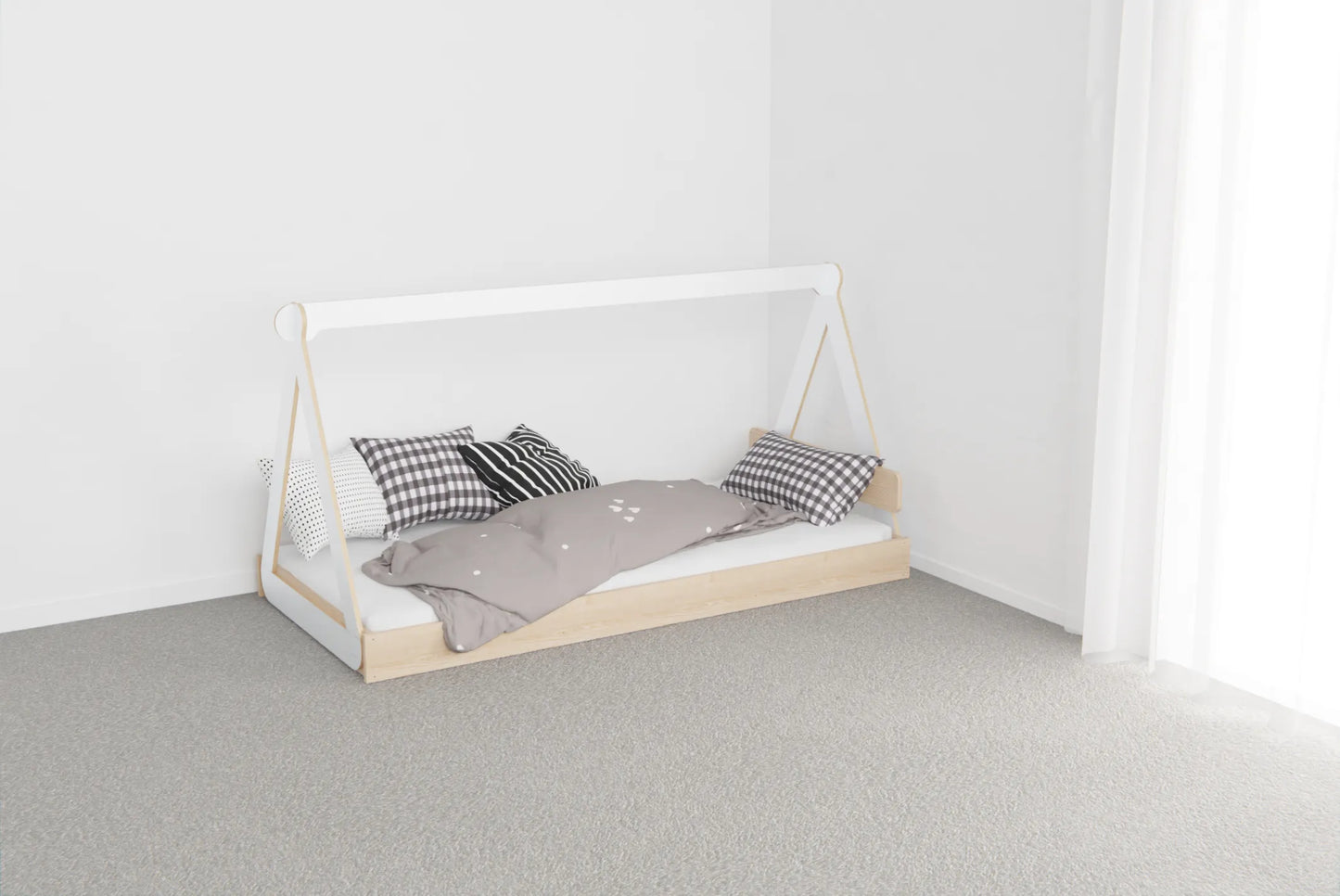 Low Montessori-style canopy floor bed made from NZ pine with birch plywood top, designed for safe independent sleep for young children
