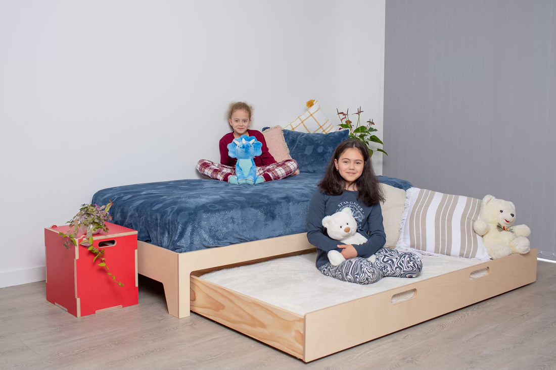 Birch plywood trundle bed prepared for a child’s sleepover, neat and inviting