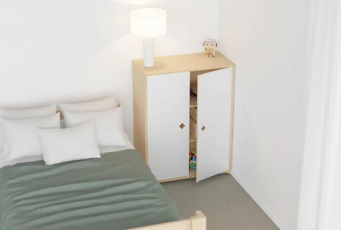 Kids’ room with a wooden single bed and matching wardrobe, designed for simple, organised storage