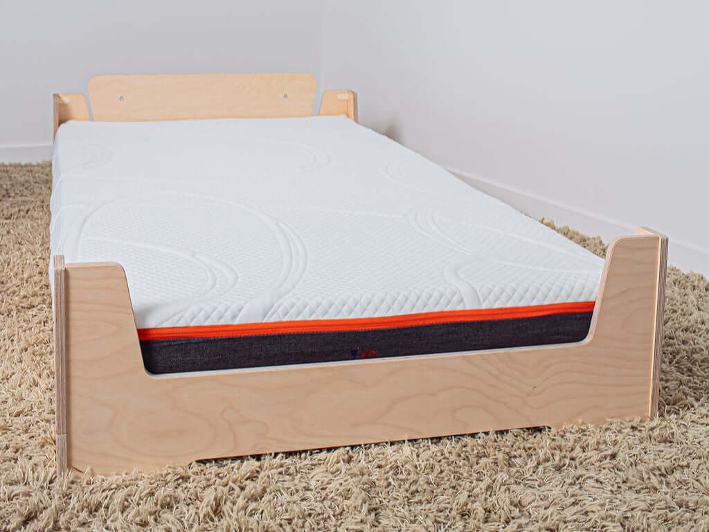 Montessori-inspired low bed with an adjustable height and a waterproof, washable mattress for toddlers to adults