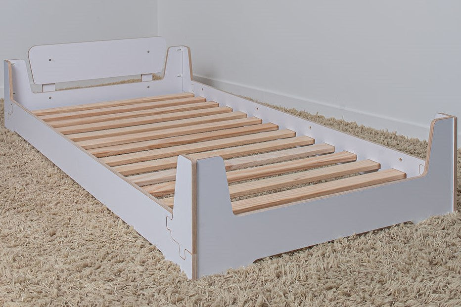 Versatile Montessori-inspired bed frame that grows with your child, converting from a low toddler bed to a full-height bed or bunk bed