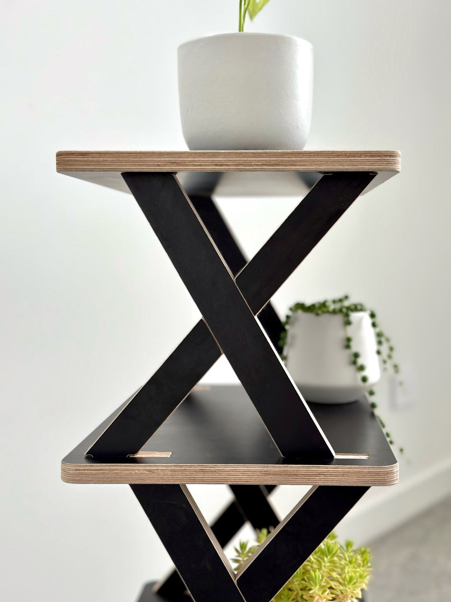 Sleek, contemporary design in NZ black plywood shelves. Showcasing natural beauty with a modern touch.