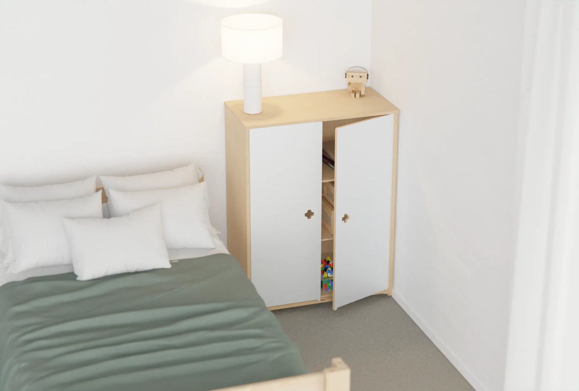 Kids’ storage cupboard in birch plywood with white doors closed, creating a calm, tidy look in the bedroom
