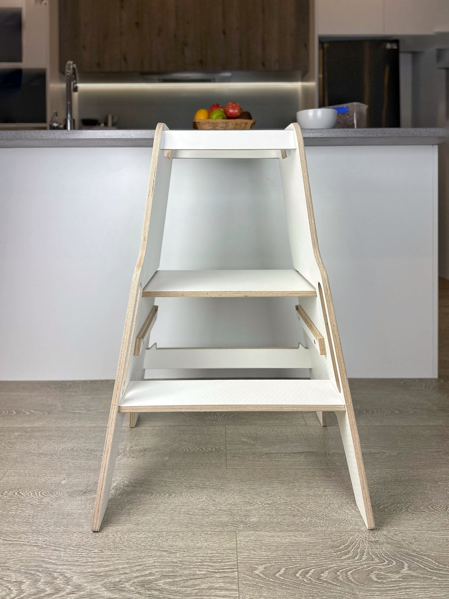Toddler kitchen helper brings children safely to bench height to build confidence and coordination