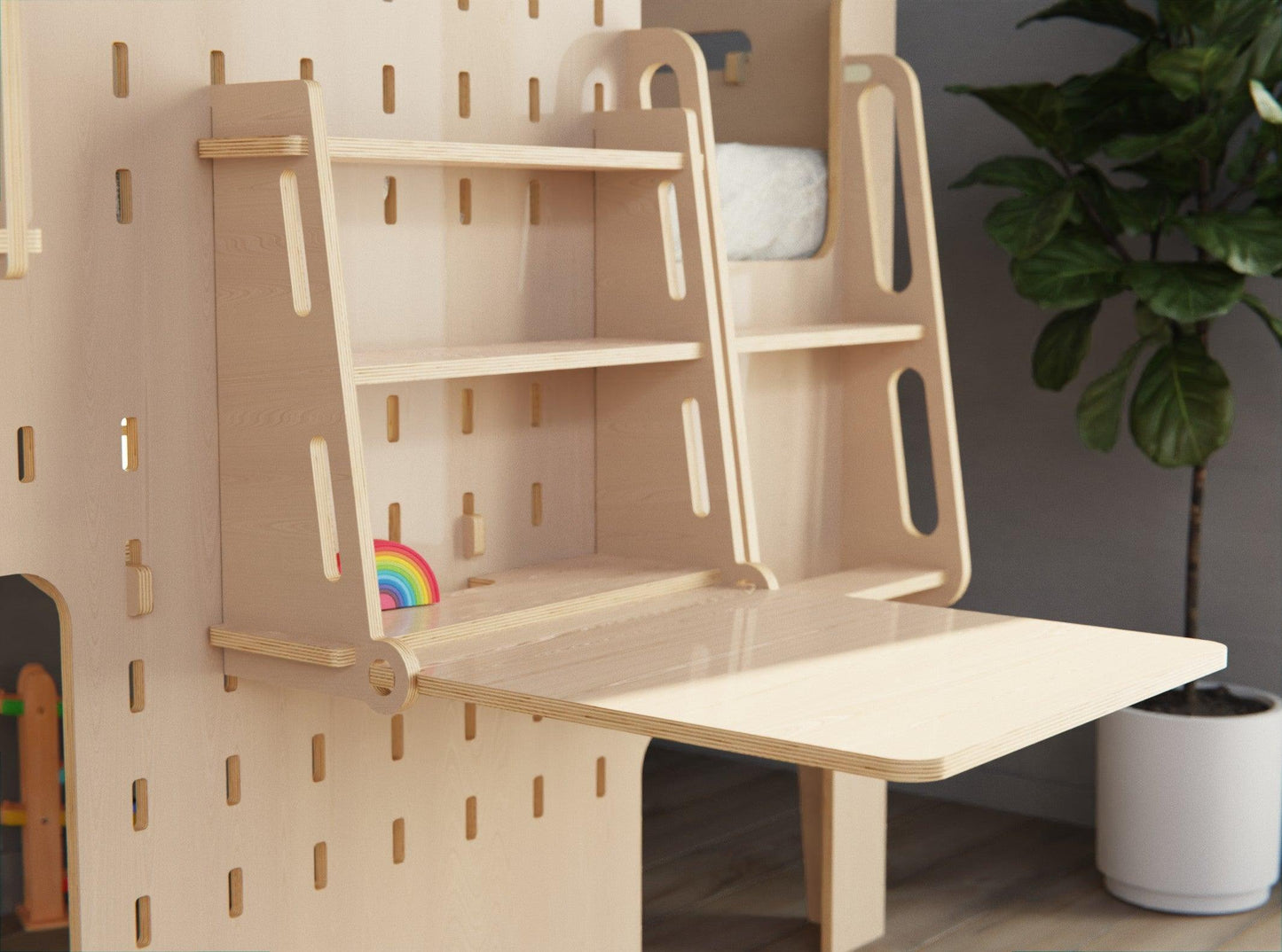 Educational space: Low loft bed for children with attached study desk.
