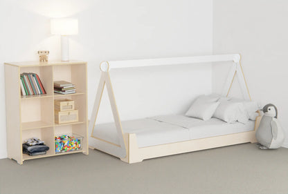 Montessori-style canopy bed for kids made from smooth birch plywood, with a low flippable base creating a cosy sleep and play nook