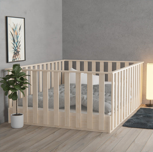 Montessori floor bed with high rails in natural NZ pine — low, safe and toddler-friendly with easy access