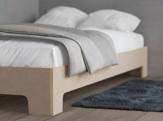 Versatile wooden bed is suitable for both kids and adults, and the guardrails provide added safety.