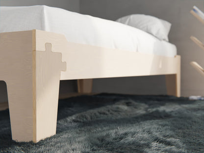 Flippable Montessori bed in natural NZ pine — grows with your child from low toddler setup to full floor bed
